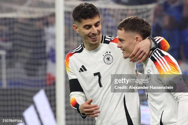 Florian Wirtz celebrates with Kai Havertz of Germany after scoring his team's first goal during the international friendly match between France and...
