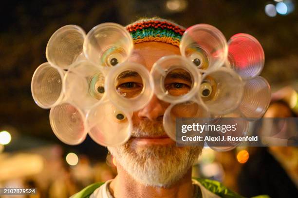 Man wearing a costume poses on Erev Purim on March 23, 2024 in Tel Aviv, Israel. The Jewish holiday of Purim commemorates the saving of the Jewish...