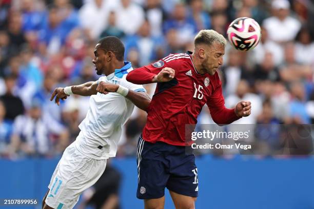 Francisco Calvo of Costa Rica goes for a header against Jerry Bengtson of Honduras during Play-In - Concacaf Nations League match between Costa Rica...