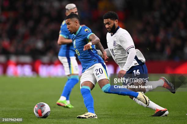 Savinho of Brazil is challenged by Joe Gomez of England during the international friendly match between England and Brazil at Wembley Stadium on...