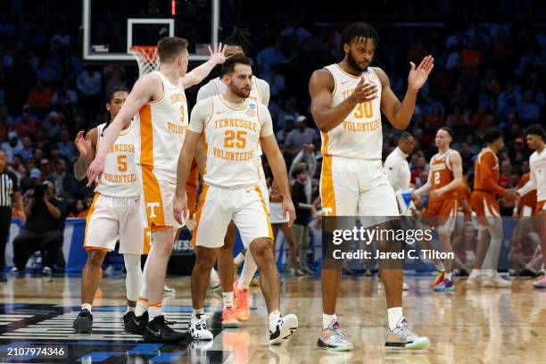 Josiah-Jordan James and Santiago Vescovi of the Tennessee Volunteers react after a timeout during the first half against the Texas Longhorns in the...