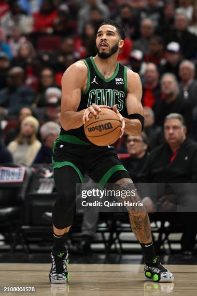 Jayson Tatum of the Boston Celtics shoots in the first half against the Chicago Bulls at the United Center on March 23, 2024 in Chicago, Illinois....