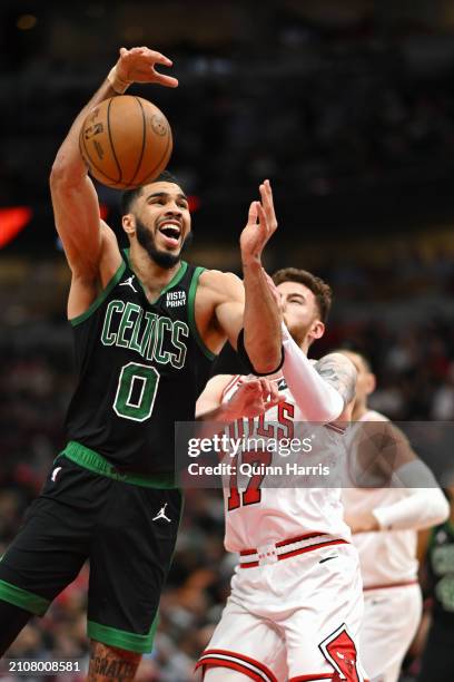 Jayson Tatum of the Boston Celtics is fouled shooting in the first half against Onuralp Bitim of the Chicago Bulls at the United Center on March 23,...
