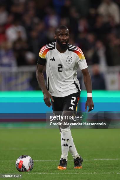 Antonio Rüdiger of Germany runs with the ball during the international friendly match between France and Germany at Groupama Stadium on March 23,...