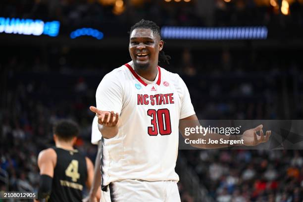 Burns Jr. #30 of the North Carolina State Wolfpack reacts during overtime of a game against the Oakland Golden Grizzlies in the second round of the...
