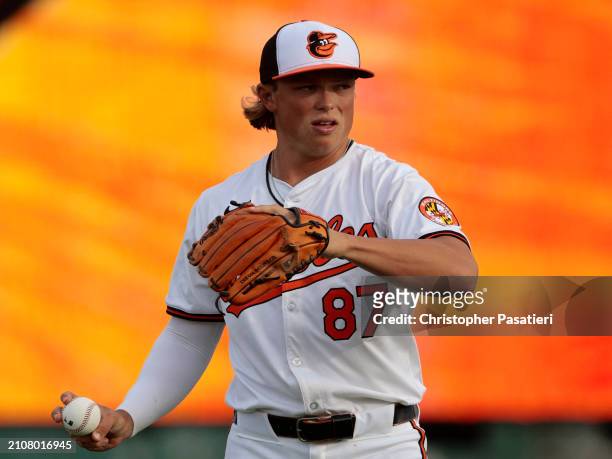 Jackson Holliday of the Baltimore Orioles stretches warms up prior to a spring training game against the Atlanta Braves at Ed Smith Stadium on March...