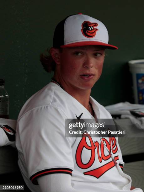 Jackson Holliday of the Baltimore Orioles looks on from the dugout prior to a spring training game against the Atlanta Braves at Ed Smith Stadium on...