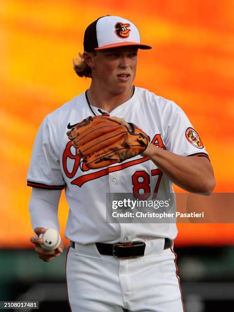 Jackson Holliday of the Baltimore Orioles stretches warms up prior to a spring training game against the Atlanta Braves at Ed Smith Stadium on March...