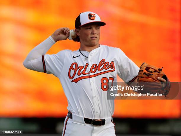 Jackson Holliday of the Baltimore Orioles stretches warms up prior to a spring training game against the Atlanta Braves at Ed Smith Stadium on March...