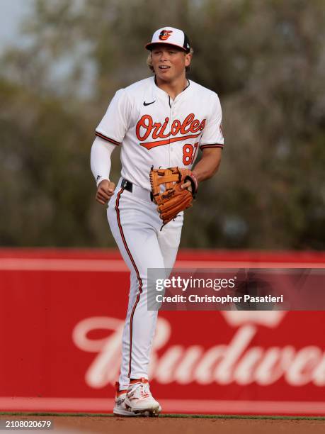 Jackson Holliday of the Baltimore Orioles sin action during a spring training game against the Atlanta Braves at Ed Smith Stadium on March 13, 2024...