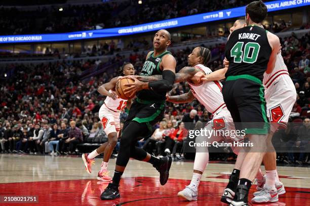 DeMar DeRozan of the Chicago Bulls knocks the ball aways from Al Horford of the Boston Celtics in the first half at the United Center on March 23,...