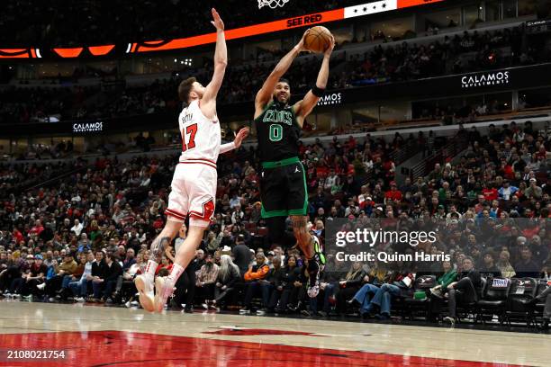 Jayson Tatum of the Boston Celtics shoots in the first half against Onuralp Bitim of the Chicago Bulls at the United Center on March 23, 2024 in...