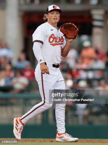 Jackson Holliday of the Baltimore Orioles sin action during a spring training game against the Atlanta Braves at Ed Smith Stadium on March 13, 2024...