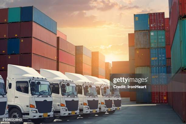 truck fleet at the container depot as for shipping concept. - convoy fotografías e imágenes de stock