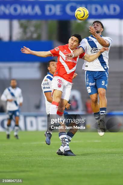 Jesus Venegas of Juarez fights for the ball with Lucas Cavallini of Puebla during the 7th round match between FC Juarez and Puebla as part of the...