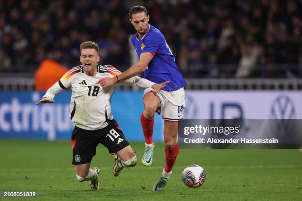 Maximilian Mittelstaedt of Germany is challenged by Adrien Rabiot of France during the international friendly match between France and Germany at...