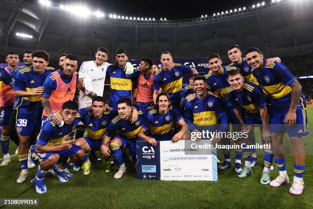 Edinson Cavani and Marcos Rojo of Boca Juniors hold the winner's check with teammates after a round of 64 match as part of Copa Argentina 2024...