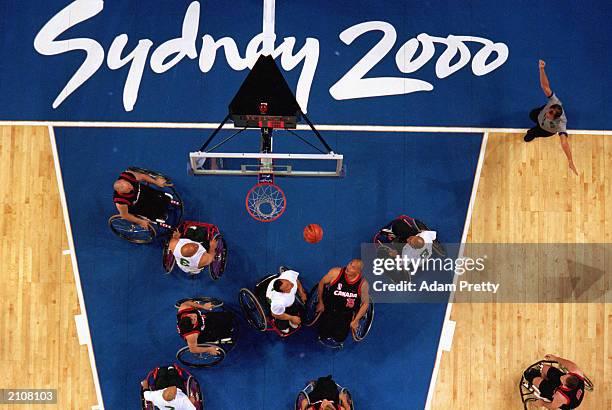 Richard Peter of Team Canada watches the ball in the Men's Wheelchair Basketball Prelims against Team Mexico during the Sydney 2000 Paralympic Games...