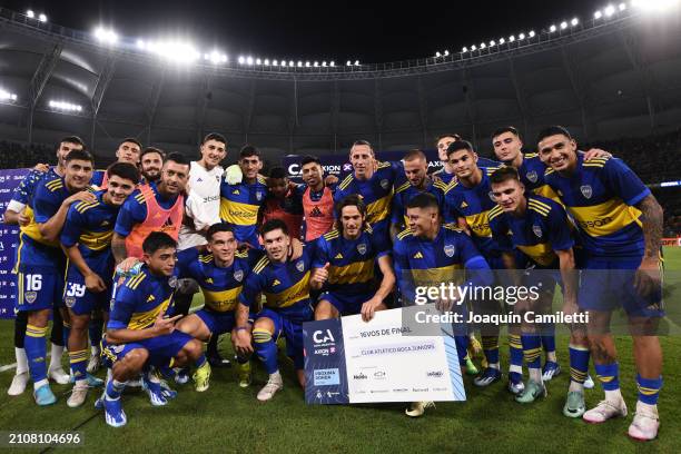 Edinson Cavani and Marcos Rojo of Boca Juniors hold the winner's check with teammates after a round of 64 match as part of Copa Argentina 2024...