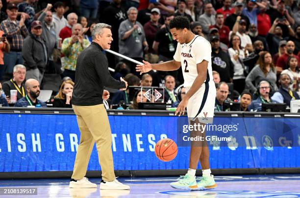 Head coach Tony Bennett and Reece Beekman of the Virginia Cavaliers celebrate after a 66-60 victory against the Boston College Eagles in the...