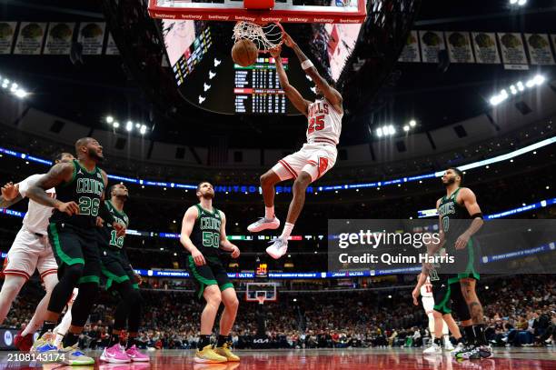 Dalen Terry of the Chicago Bulls dunks in the second half against the Boston Celtics at the United Center on March 23, 2024 in Chicago, Illinois....