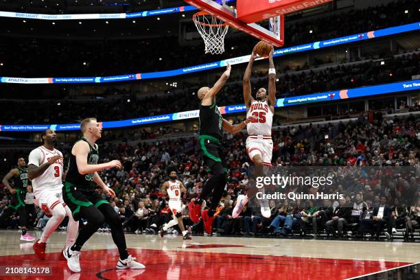 Dalen Terry of the Chicago Bulls goes up to dunk in the second half against the Boston Celtics at the United Center on March 23, 2024 in Chicago,...