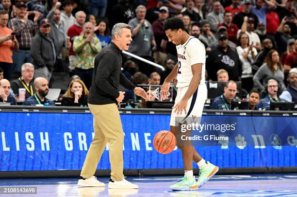 Head coach Tony Bennett and Reece Beekman of the Virginia Cavaliers celebrate after a 66-60 victory against the Boston College Eagles in the...