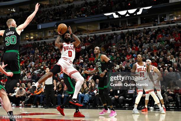 Coby White of the Chicago Bulls is fouled shooting in the second half against the Boston Celtics at the United Center on March 23, 2024 in Chicago,...