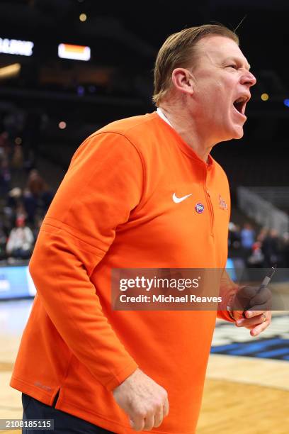 Head coach Brad Underwood of the Illinois Fighting Illini celebrates after defeating the Duquesne Dukes 89-63 in the second round of the NCAA Men's...