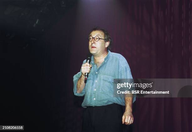 Dutch comedian and columnist Youp van 't Hek , performing live on stage