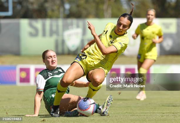 Tegan Bertolissio of Canberra United tackles Emma Main of the Phoenix during the A-League Women round 21 match between Canberra United and Wellington...