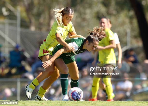 Macey Fraser of the Phoenix and Emma Ilijoski of Canberra United contest possession during the A-League Women round 21 match between Canberra United...