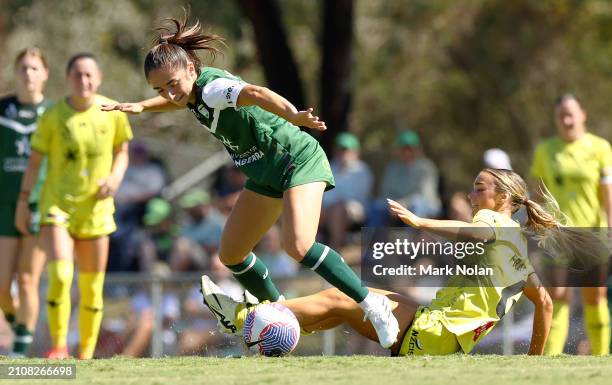 Macey Fraser of the Phoenix and Emma Ilijoski of Canberra United contest possession during the A-League Women round 21 match between Canberra United...