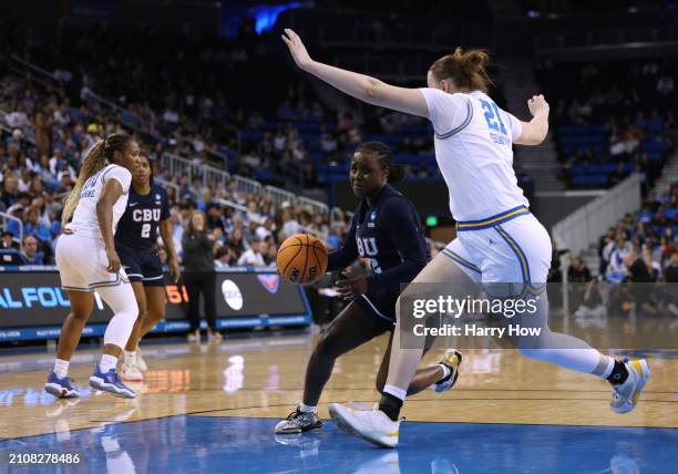Nae Nae Calhoun of the California Baptist Lancers drives to the basket on Lina Sontag of the UCLA Bruins in an 84-55 UCLA win during the NCAA Women's...