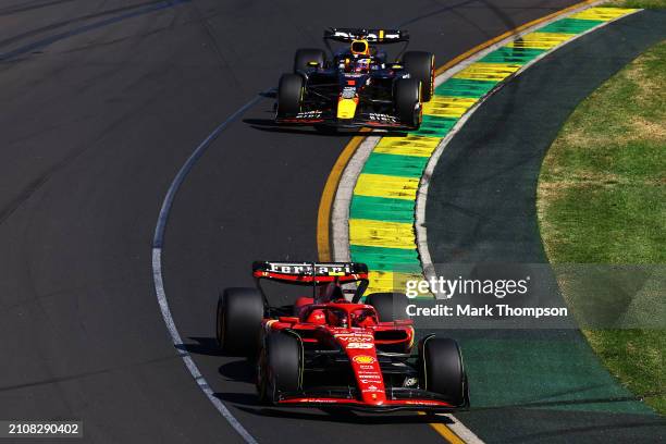 Carlos Sainz of Spain driving the Ferrari SF-24 leads Max Verstappen of the Netherlands driving the Oracle Red Bull Racing RB20 during the F1 Grand...