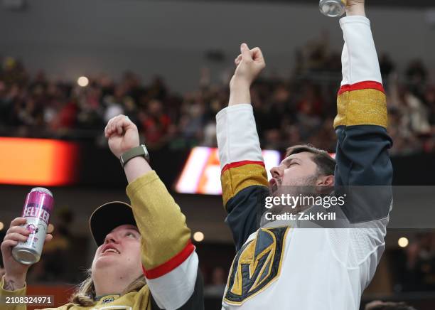 Vegas Golden Knights fans cheer after a goal during the third period against the Columbus Blue Jackets at T-Mobile Arena on March 23, 2024 in Las...