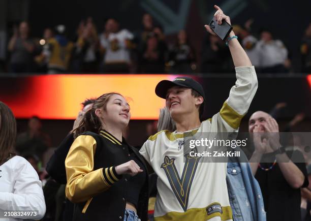 Vegas Golden Knights fans cheer after a goal during the third period against the Columbus Blue Jackets at T-Mobile Arena on March 23, 2024 in Las...