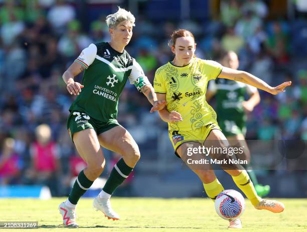 Michelle Heyman of Canberra United and Mackenzie Barry of the Phoenix contest possession during the A-League Women round 21 match between Canberra...