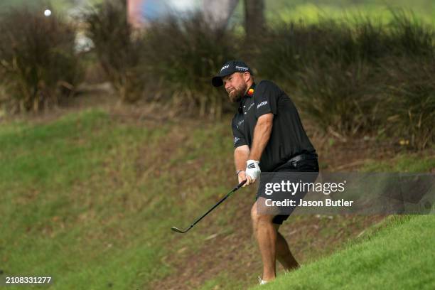 Shane Lowry of Ireland pitches onto the green on hole 3 during Day Four of the Porsche Singapore Classic at Laguna National Golf Resort Club on March...