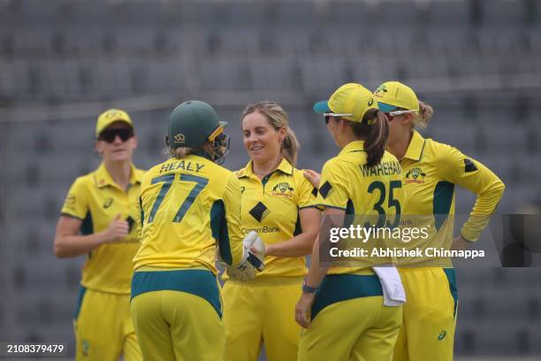 Australia's players celebrate with team mate Sophie Molineux after the dismissal of Nigar Sultana of Bangladesh during game two of the Women's One...