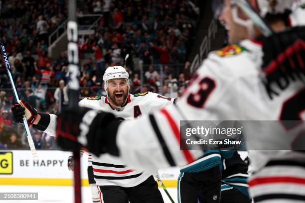 Nick Foligno celebrates after Philipp Kurashev of the Chicago Blackhawks celebrates after he scored the game-tying goal with less than a minute to...