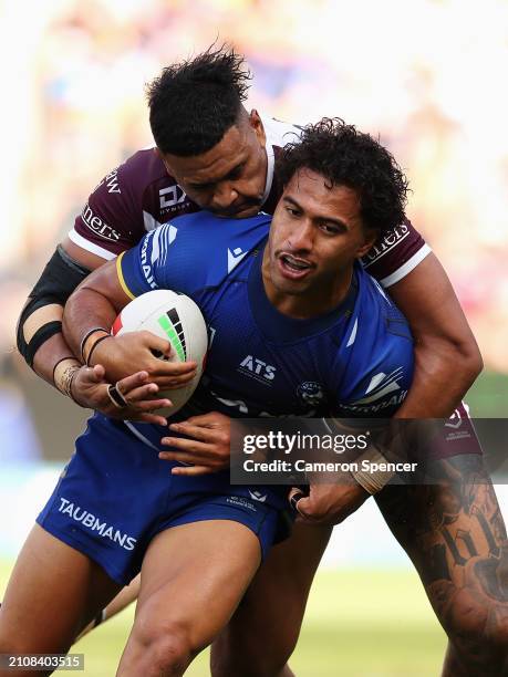 Will Penisini of the Eels is tackled during the round three NRL match between Parramatta Eels and Manly Sea Eagles at CommBank Stadium, on March 24...