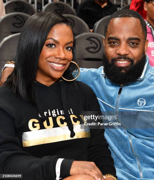 Kandi Burruss and Todd Tucker attend the game between the Atlanta Hawks and the Charlotte Hornets at State Farm Arena on March 23, 2024 in Atlanta,...