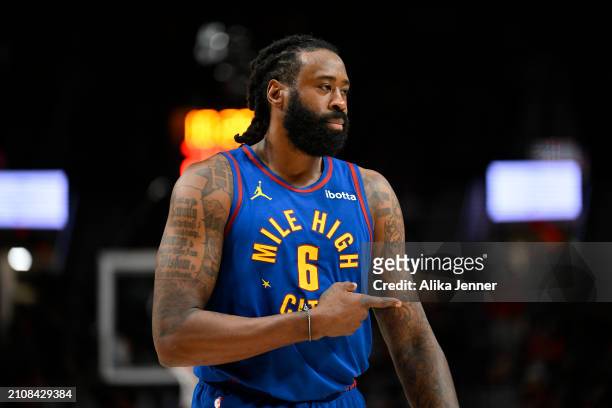 DeAndre Jordan of the Denver Nuggets gestures during the third quarter of the game against the Portland Trail Blazers at the Moda Center on March 23,...