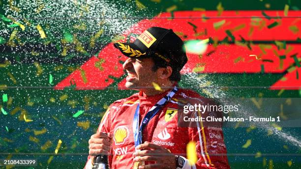 Race winner Carlos Sainz of Spain and Ferrari celebrates on the podium during the F1 Grand Prix of Australia at Albert Park Circuit on March 24, 2024...