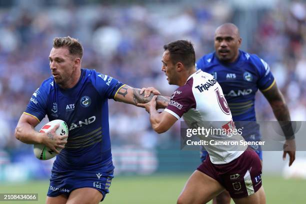 Bryce Cartwright of the Eels is tackled during the round three NRL match between Parramatta Eels and Manly Sea Eagles at CommBank Stadium, on March...