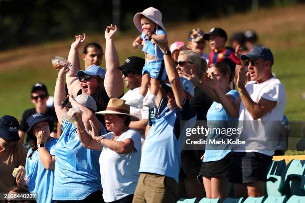 Sydney FC supporters celebrate a goal during the A-League Women round 21 match between Sydney FC and Adelaide United at Leichhardt Oval, on March 24...