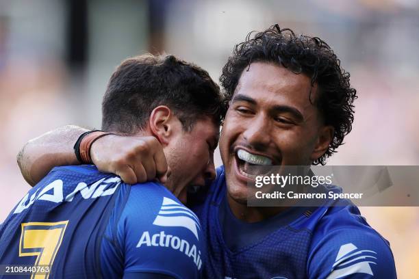 Mitchell Moses of the Eels celebrates a try with Will Penisini of the Eels during the round three NRL match between Parramatta Eels and Manly Sea...