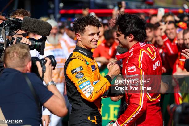 Lando Norris of Great Britain and McLaren F1 and Carlos Sainz of Spain and Scuderia Ferrari share a hug in parc ferme after the F1 Grand Prix of...
