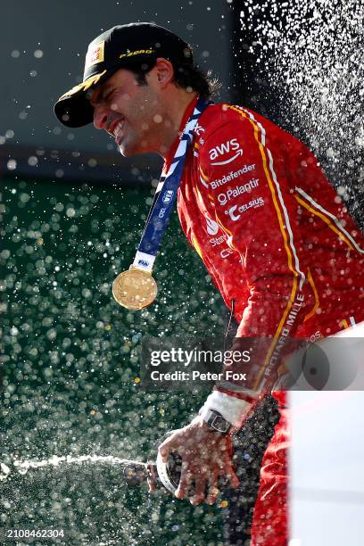 Race winner Carlos Sainz of Spain and Ferrari celebrates on the podium during the F1 Grand Prix of Australia at Albert Park Circuit on March 24, 2024...